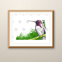 Purple Hummingbird art print in an oak frame on a wall