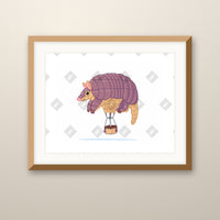 Armadillo Balloon art print in an oak frame on a wall