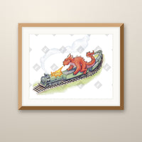 Train art print in an oak frame on a wall
