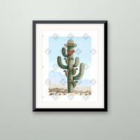 Tall Saguaro art print in a black frame on a wall