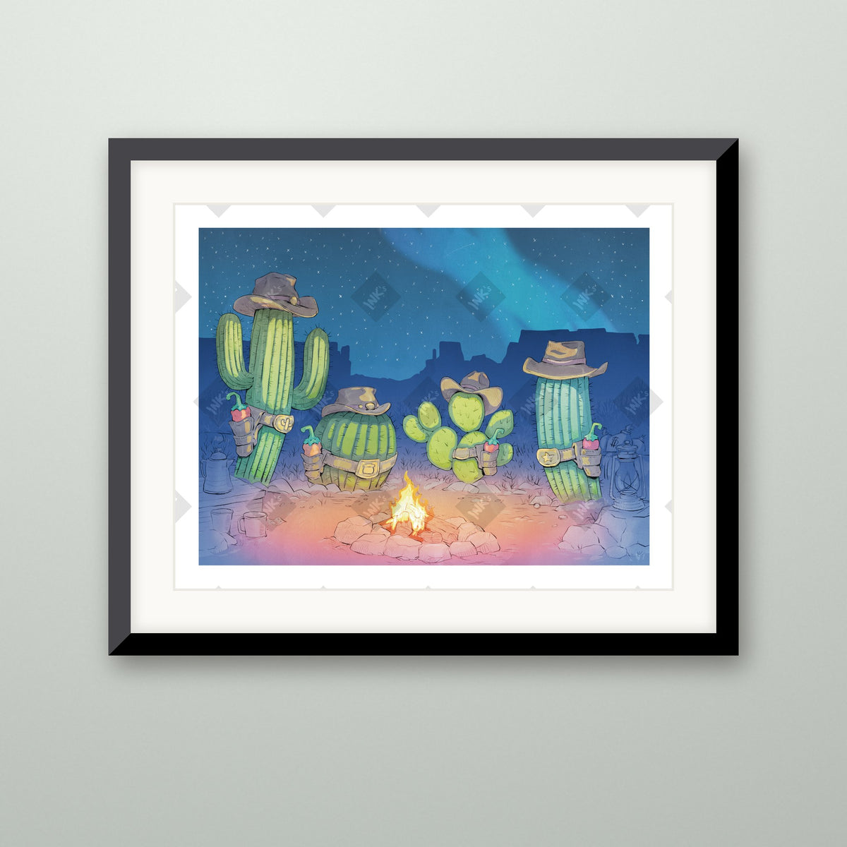 Cactus Campfire art print in a black frame on a wall