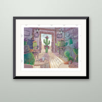 Cactus Saloon art print in a black frame on a wall